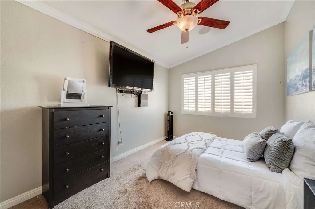 Bedroom #4 with Ceiling Fan, High Ceilings, Crown Molding, and Plantation Shutters