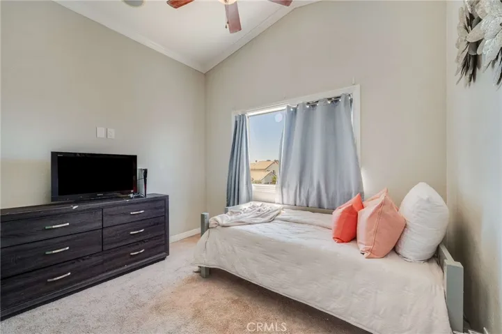 Bedroom #3 with High Ceilings, Crown Molding, and Ceiling Fan