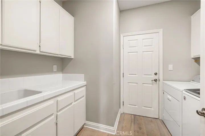 Interior laundry room with storage