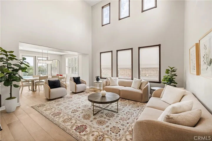 Grand living room with soaring ceilings and abundant natural light
