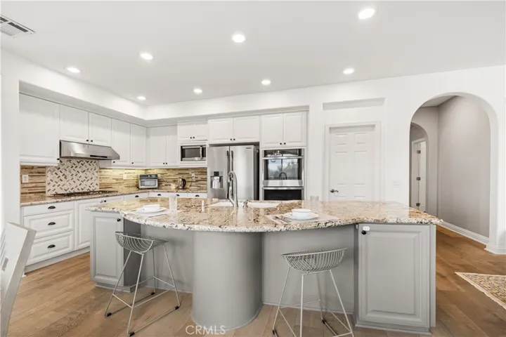 Chef's kitchen with oversized island and abundant cabinetry