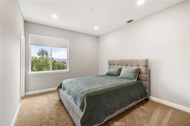 Additional upstairs bedroom with attached bathroom