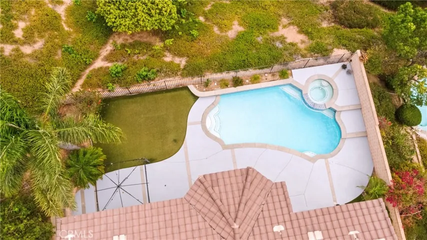 Aerial view of the pool and backyard