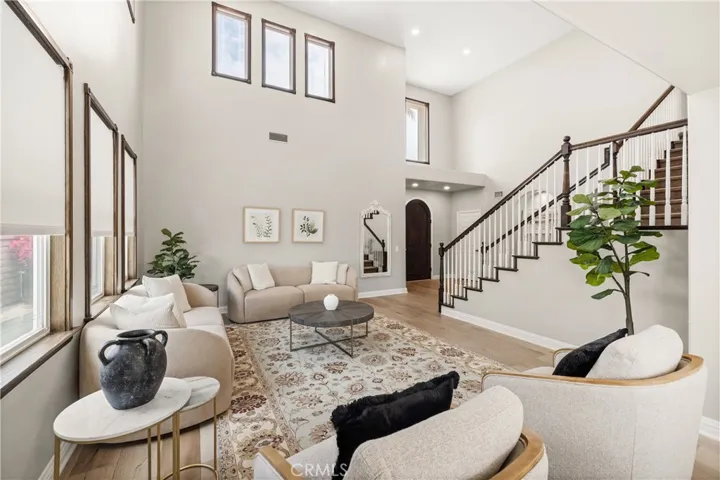 Dramatic two-story entry with elegant staircase