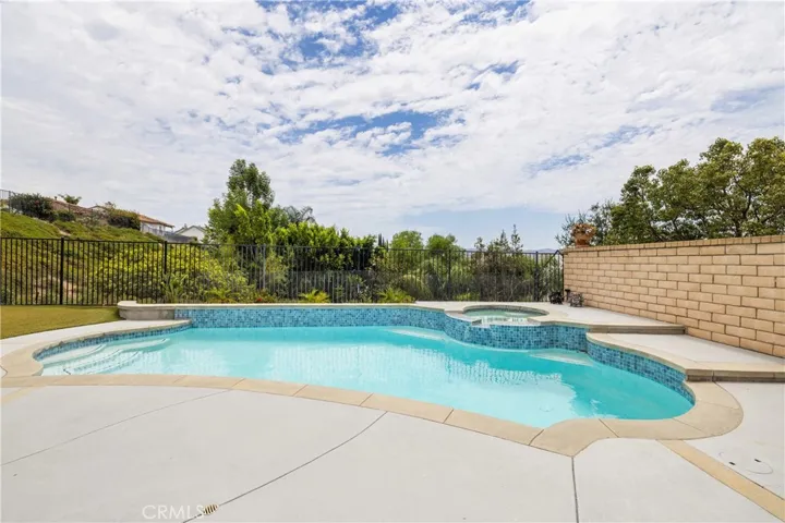 Sparkling pool with surrounding patio