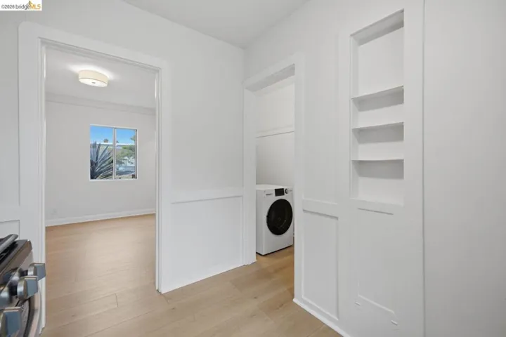 Crisp white interior with light wood-finish flooring