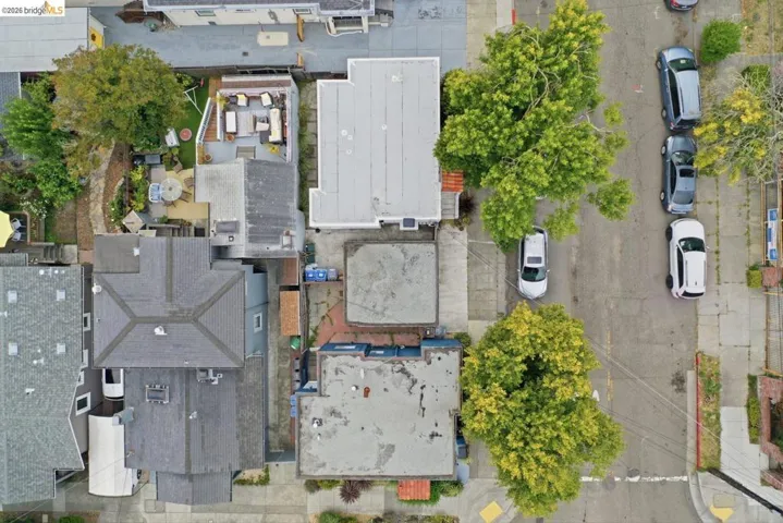 Aerial perspective showcasing multiple residential structures with varied rooflines