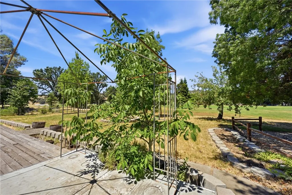 Oversized lot with fruit trees and views of Hidden Valley Lake Golf Course.