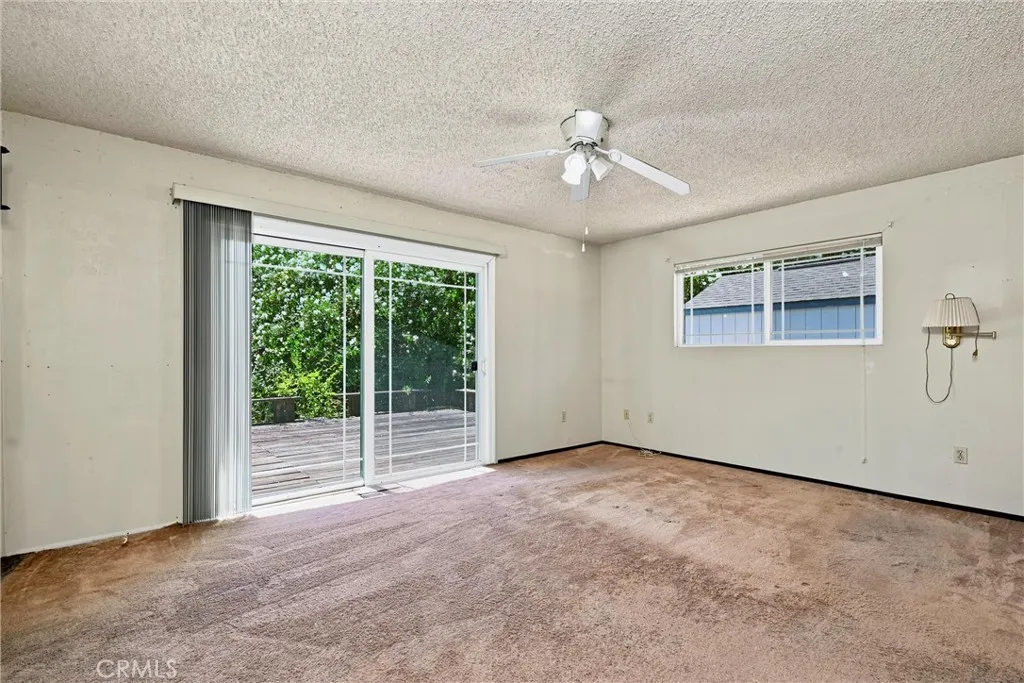 Primary bedroom leads to outside deck.