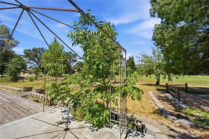 Oversized lot with fruit trees and views of Hidden Valley Lake Golf Course.