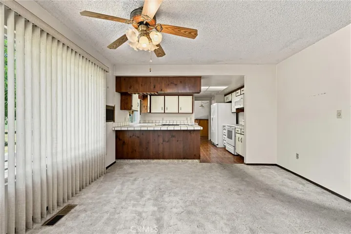 Dining area has eating bar.