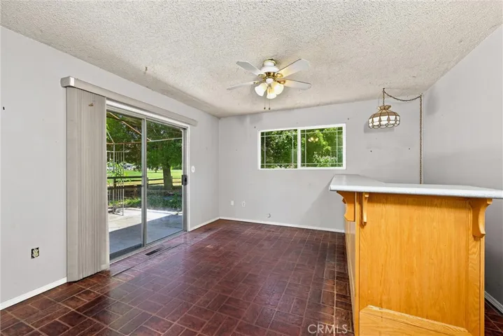 Bonus den behind the kitchen overlooks back deck and has entry from garage and powder bath.
