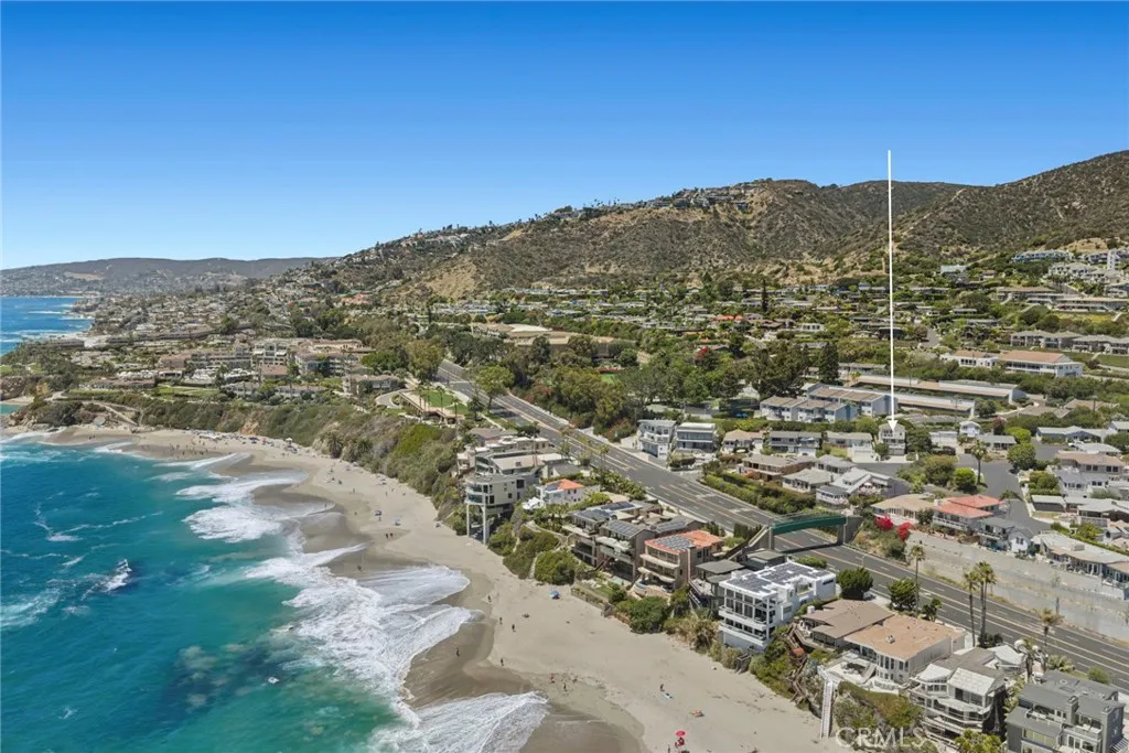 Experience coastal living at its finest in this beautifully upgraded ocean view residence, ideally situated on a private street just moments from the world-renowned Montage Laguna Beach, The Ranch at Laguna Beach and its acclaimed golf course, and the pedestrian bridge providing beach access directly across the street.
