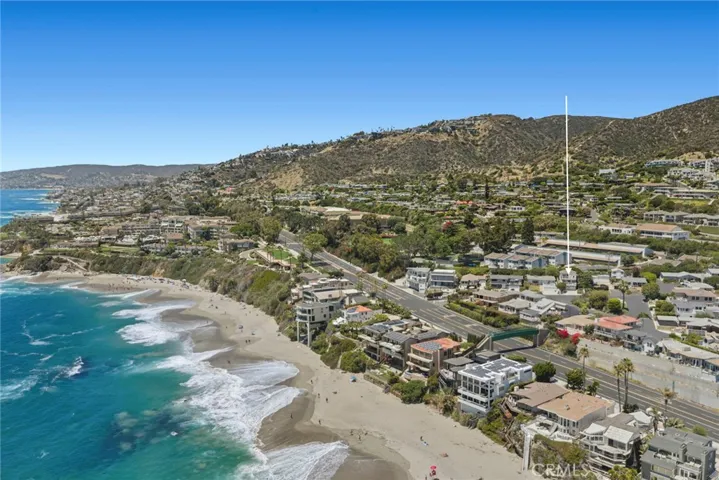 Experience coastal living at its finest in this beautifully upgraded ocean view residence, ideally situated on a private street just moments from the world-renowned Montage Laguna Beach, The Ranch at Laguna Beach and its acclaimed golf course, and the pedestrian bridge providing beach access directly across the street.