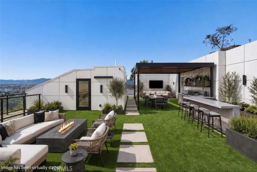 Outdoor furniture and landscaping have been virtually staged.