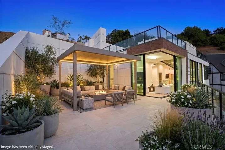 Outdoor furniture and landscaping have been virtually staged.