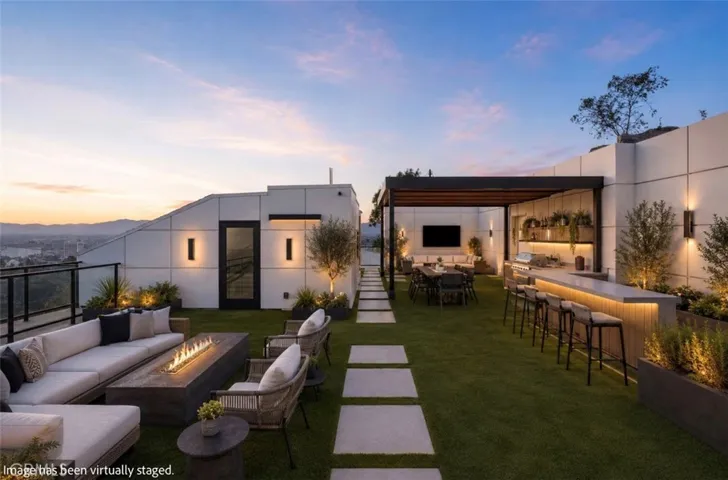 Outdoor furniture and landscaping have been virtually staged.