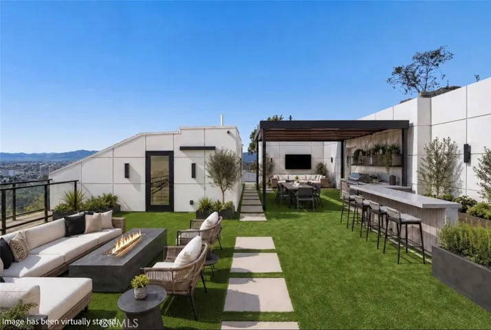 Outdoor furniture and landscaping have been virtually staged.
