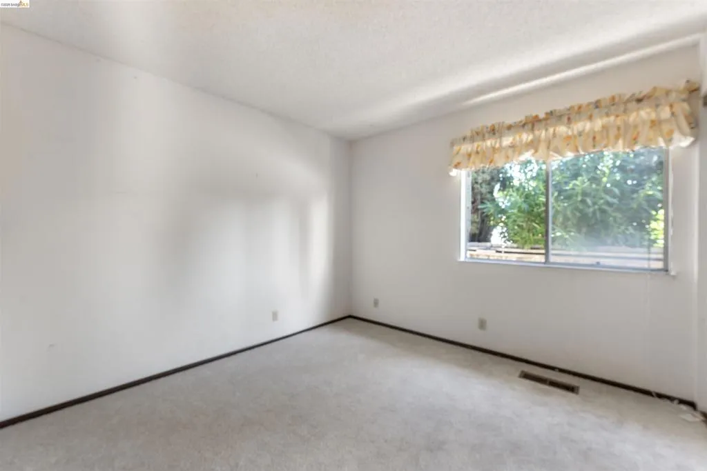 Neutral-toned carpeting paired with white walls Neutral-toned carpeting paired with white walls