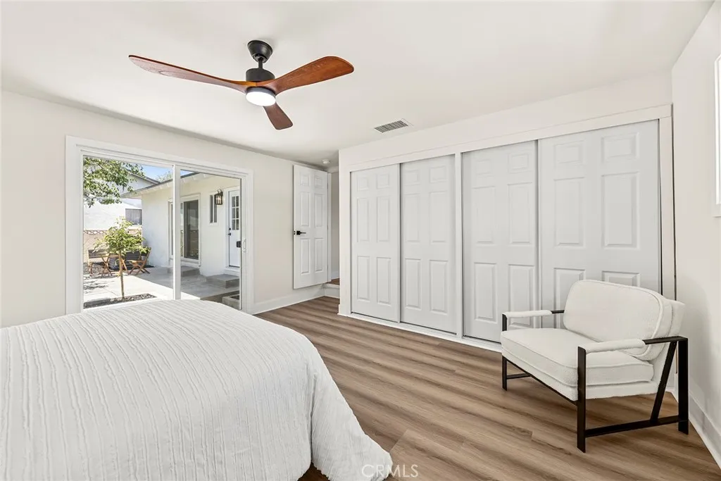 Bedroom #4 offering direct backyard access via sliding glass door — flexible for guests, a home office, or playroom