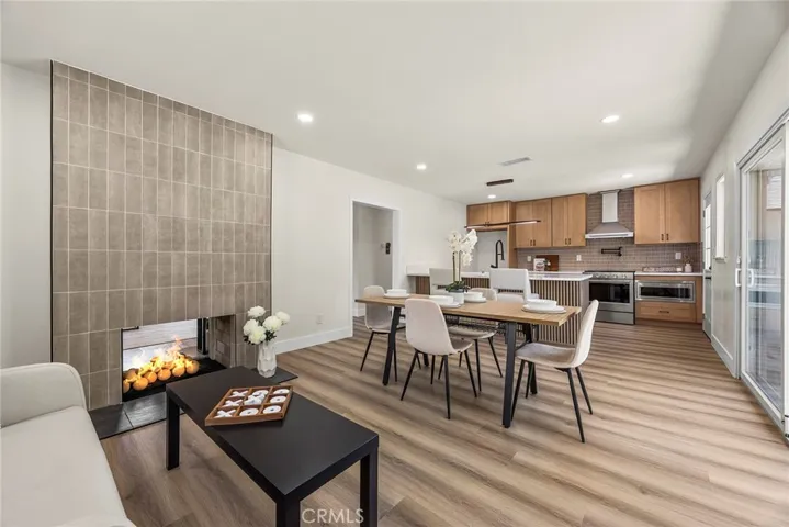 Full view of the open-concept great room connecting family, dining, and kitchen areas