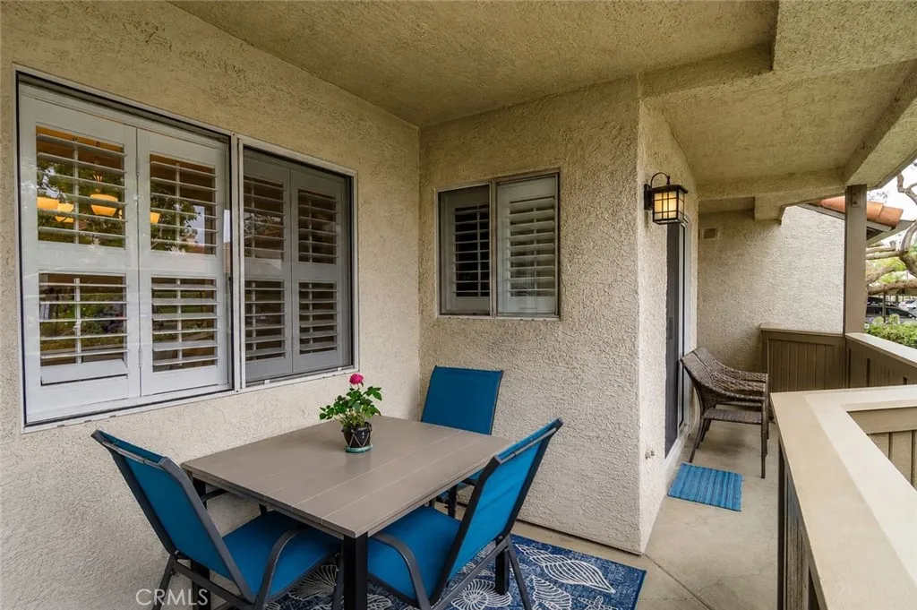 Digitally Altered Image – One patio chair has been digitally removed. Original photo follows.