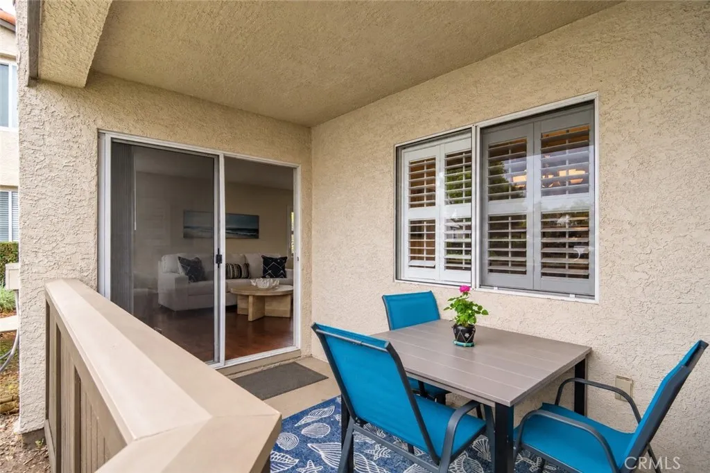 Digitally Altered Image – One patio chair has been digitally removed. Original photo follows.