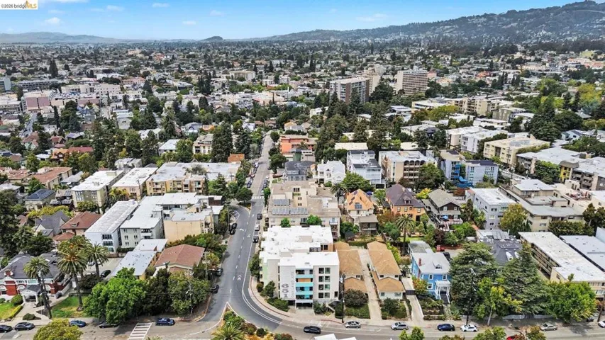 Aerial perspective showcasing a diverse urban landscape with residential and commercial buildings