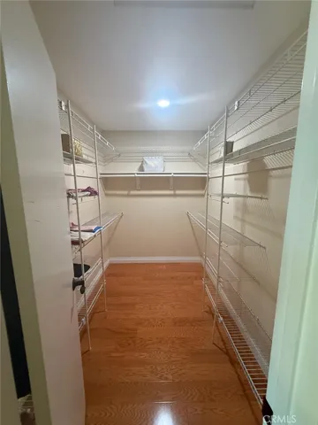 Walk in closet in master bedroom.