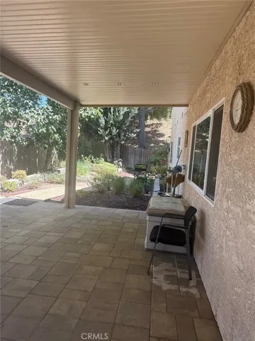 Patio cover in backyard to enjoy cool evening.