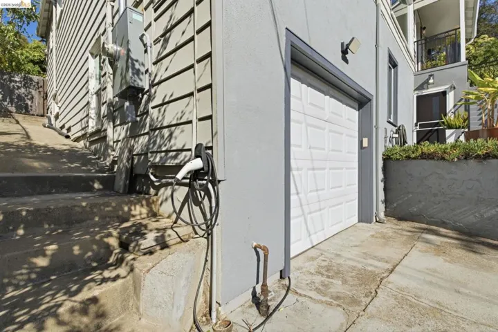 Attached garage with white panel door