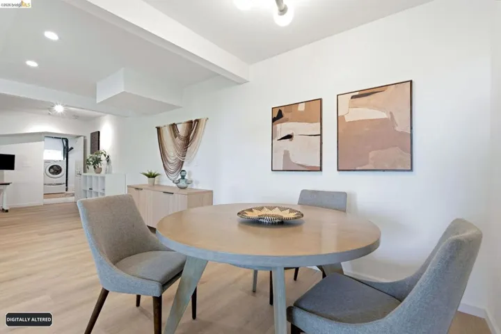 Open-concept space featuring light wood-finish flooring, recessed lighting, and a neutral color palette