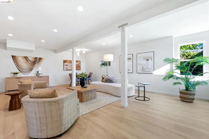 Spacious interior featuring light with luxury vinyl flooring, recessed lighting, and a neutral color palette