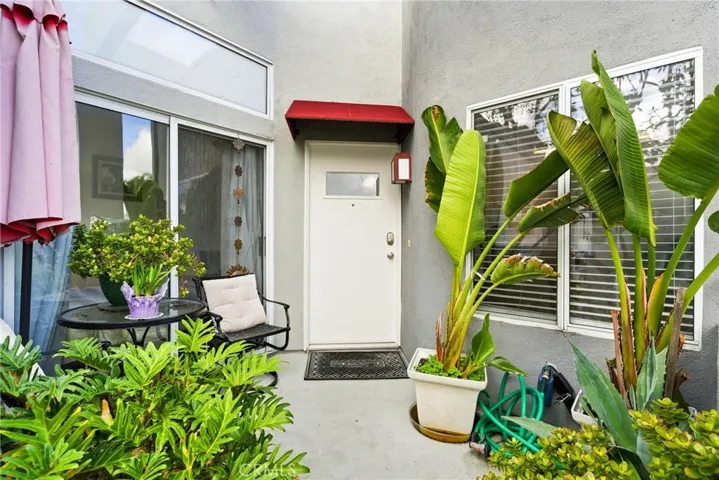 Private entrance tucked within a peaceful community setting.