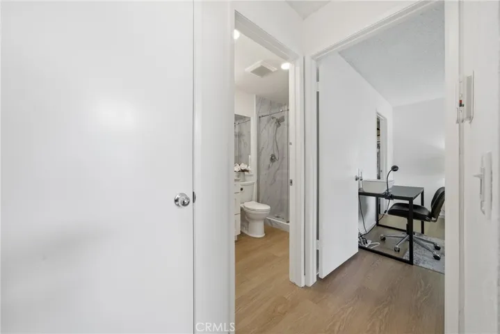 Hallway connecting the living areas to the private bedroom spaces.