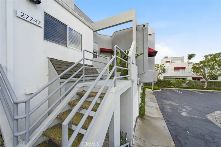 Exterior staircase leading to the private upper-level entry.