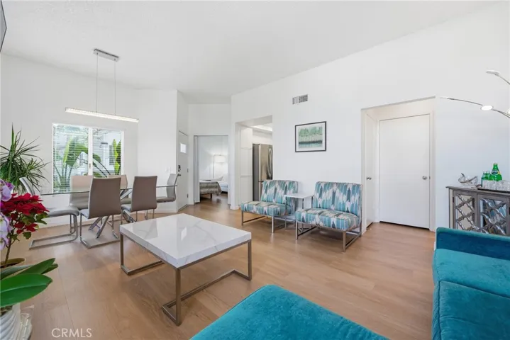 Wide plank luxury laminate flooring throughout.