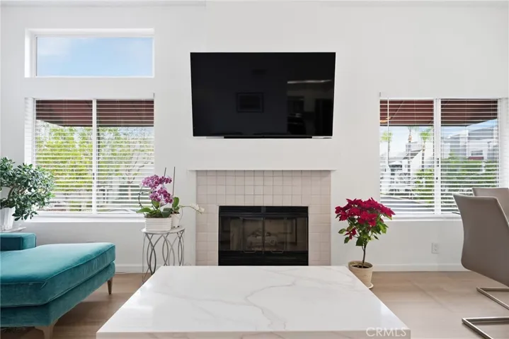 Living room anchored by a cozy fireplace.