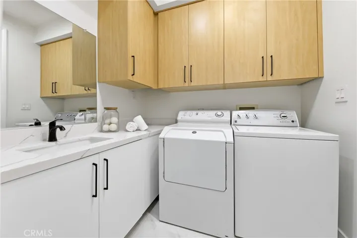 Laundry room off kitchen near garage entrance