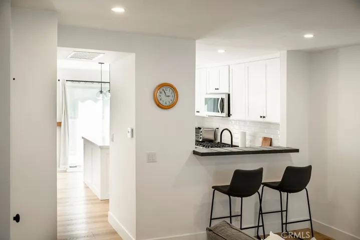 Opposite end of living room showing bar area