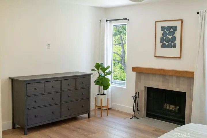 Thoughtfully recessed fireplace hearth and redesigned mantle.