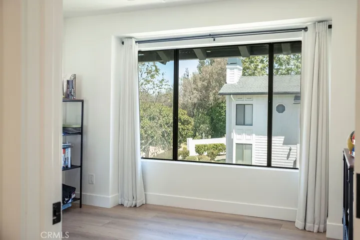 Large windows in secondary bedroom.