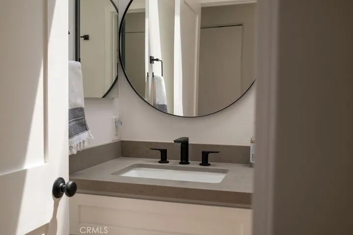 Upstair full bathroom: Sink, toilet, tub with showerhead.