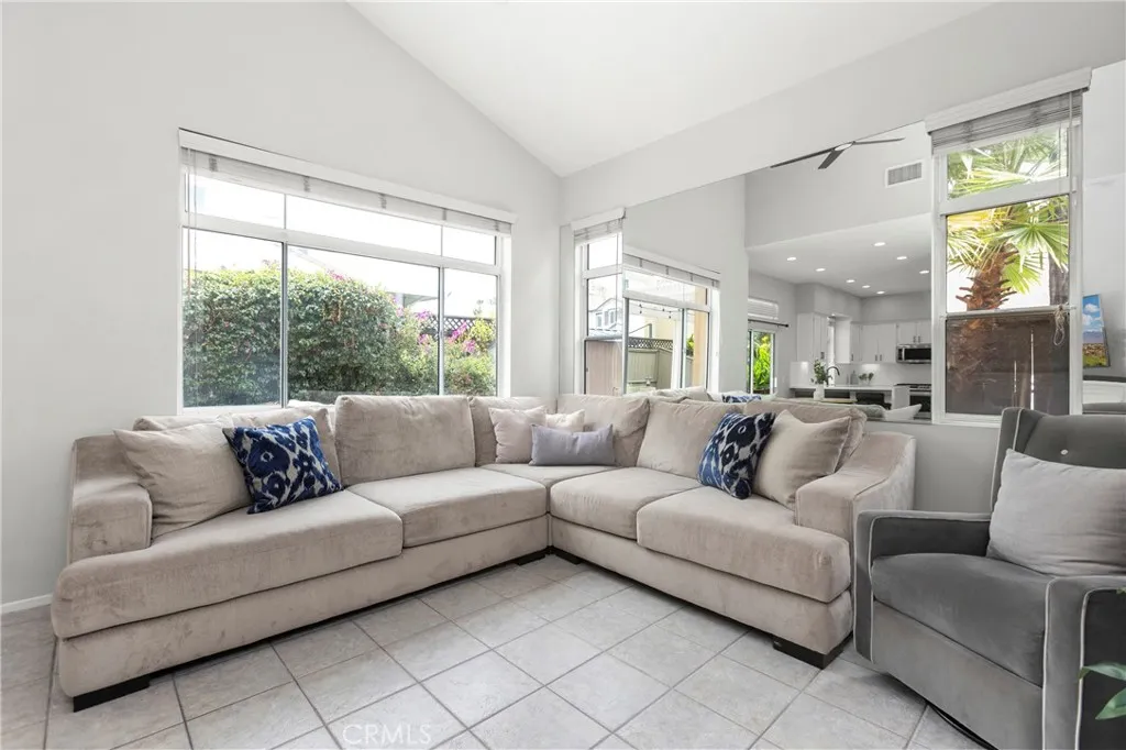 Light and bright living room with walls of windows and high ceilings
