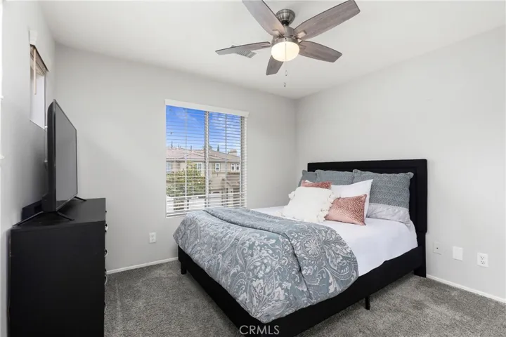 Secondary bedroom shown with queen bed