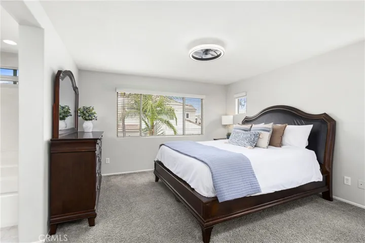 Primary suite with chandelier/ceiling fan