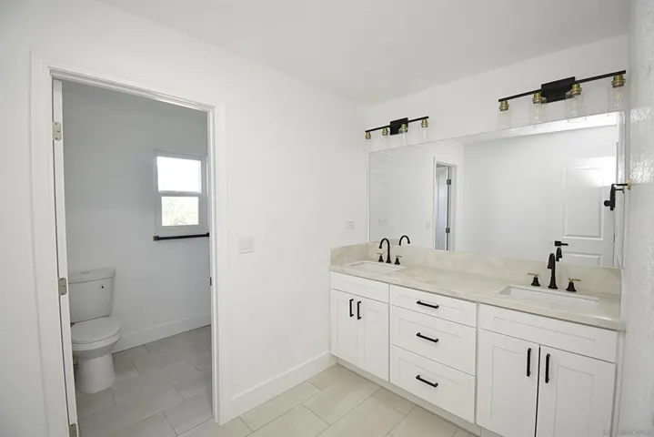UPSTAIRS HALL BATHROOM WITH DUAL SINKS