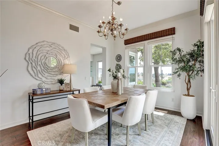 An elegant dining room with panoramic coastal views as the backdrop.