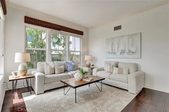 The elegant living room offers a warm and inviting space to relax or entertain.