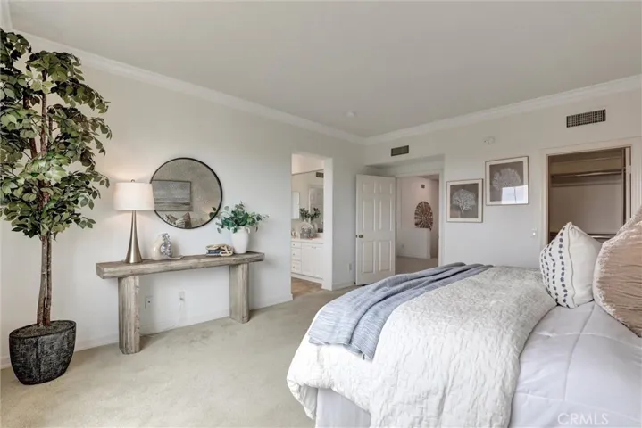 The spacious primary suite features a walk-in closet and a private ensuite bathroom, creating a comfortable and relaxing retreat.